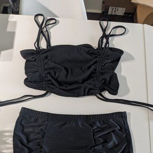 Black strappy bikini top with black bottoms